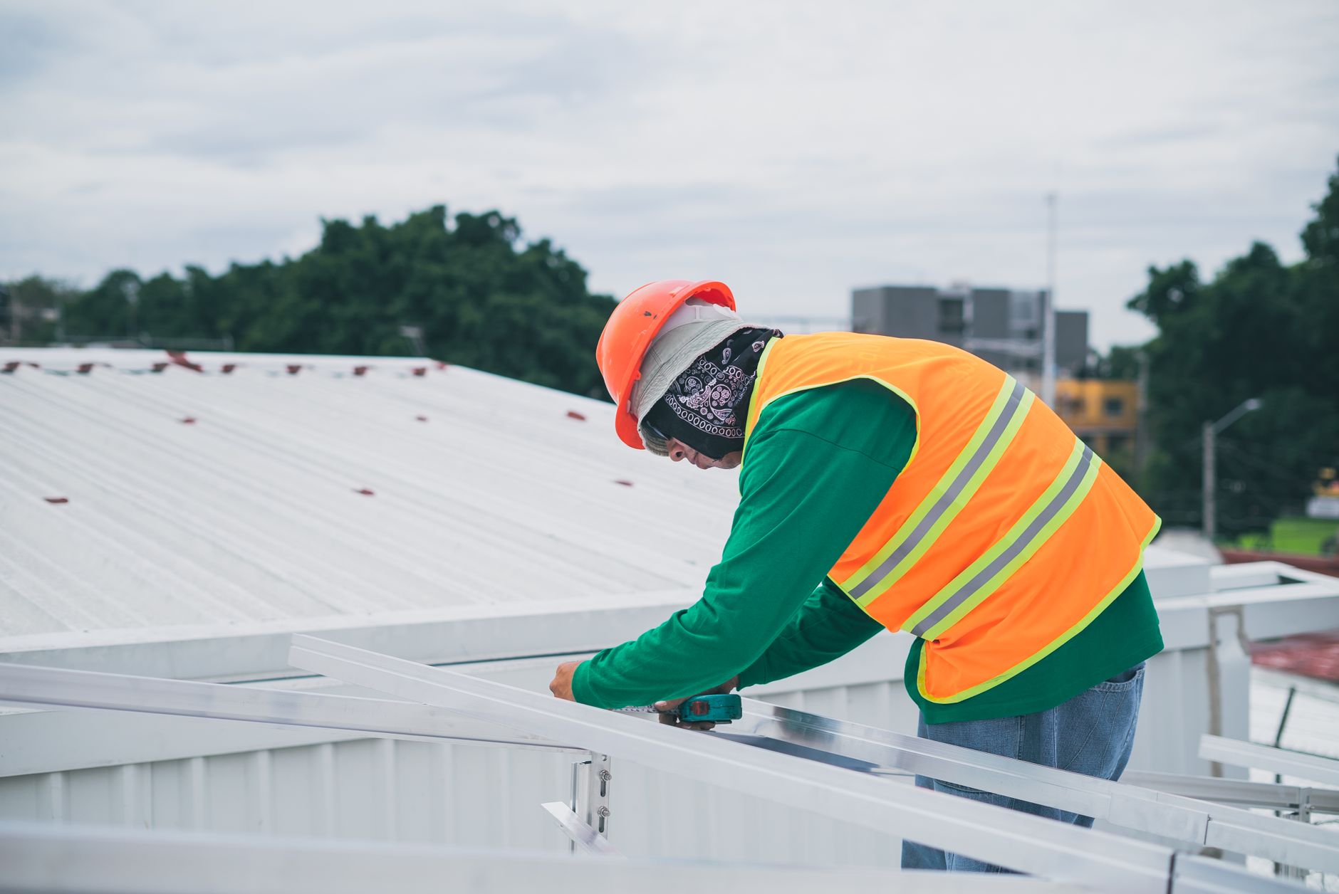 A professional roofer inspecting tile roofing on a home in Boulder City, Nevada.